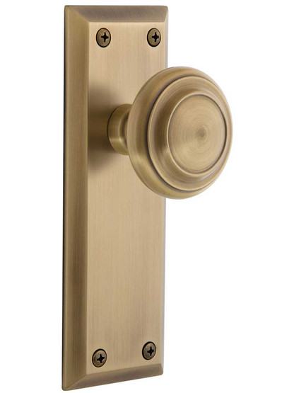 Grandeur Fifth-Avenue Door Set with Circulaire Knobs in Antique Brass.